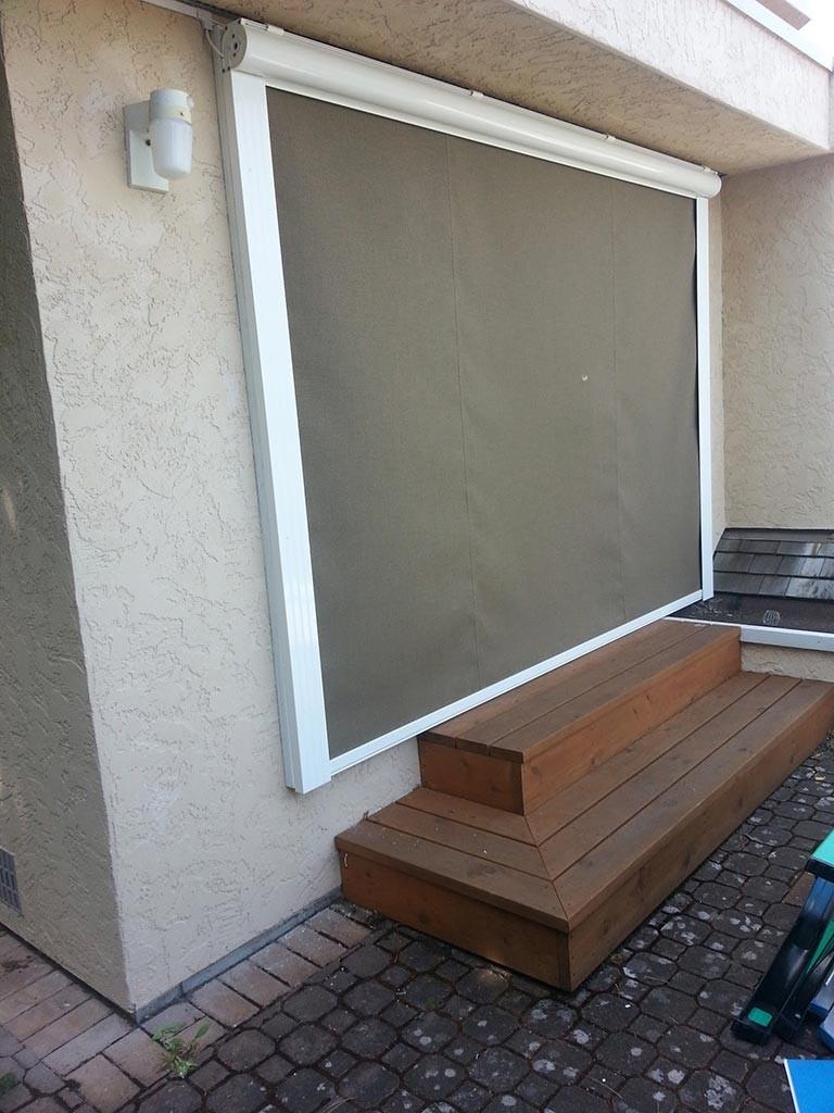 closed exterior drop awning on a patio door